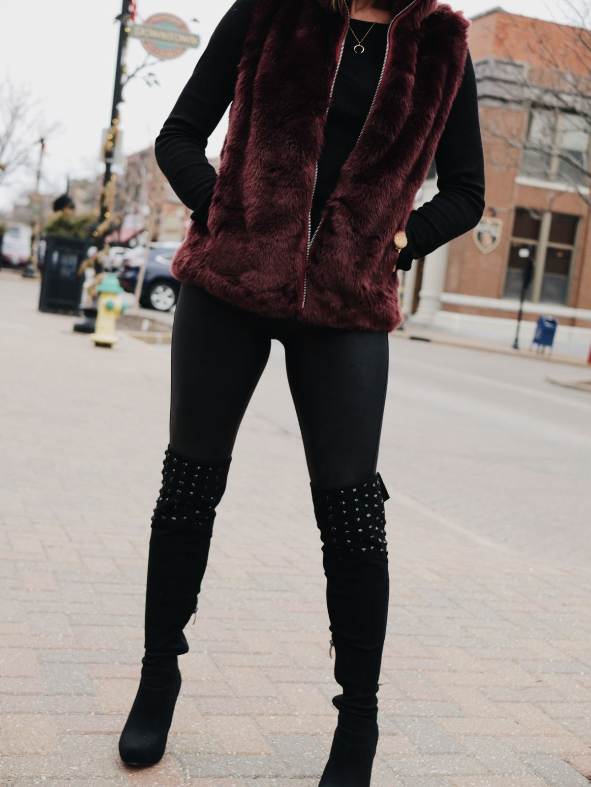 black boots and purple vests and black long sleeves