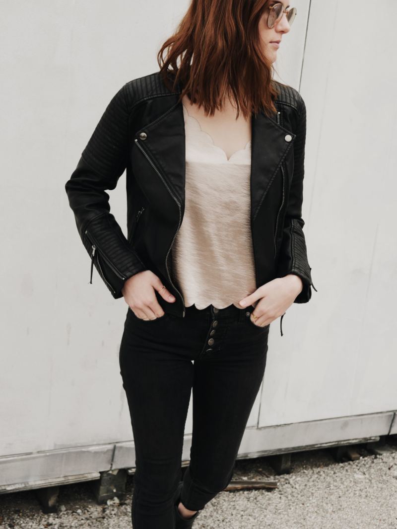 a leather jacket and black pants