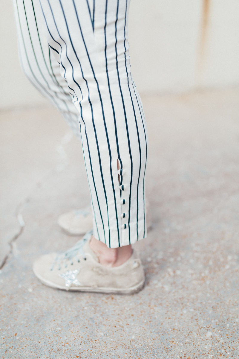 Striped pants with Golden Goose sneakers