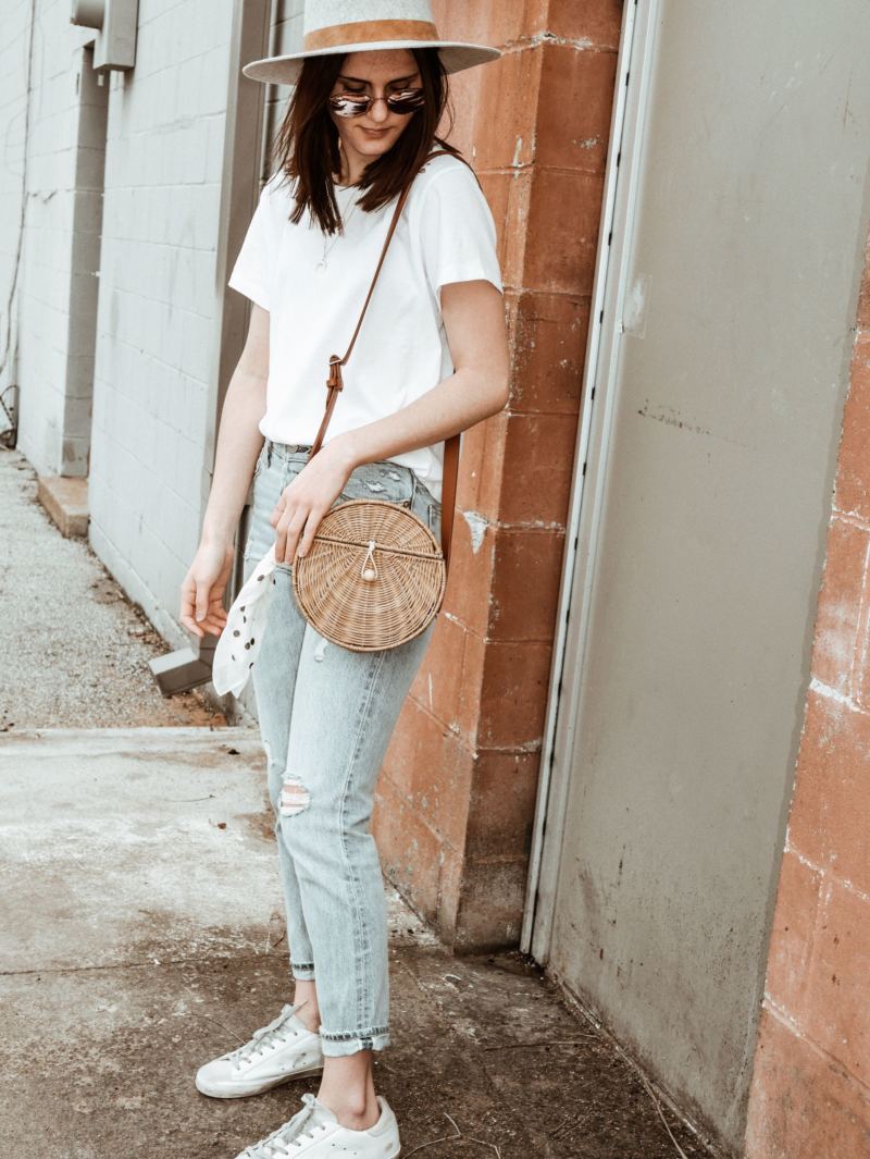 straw bag and white tee