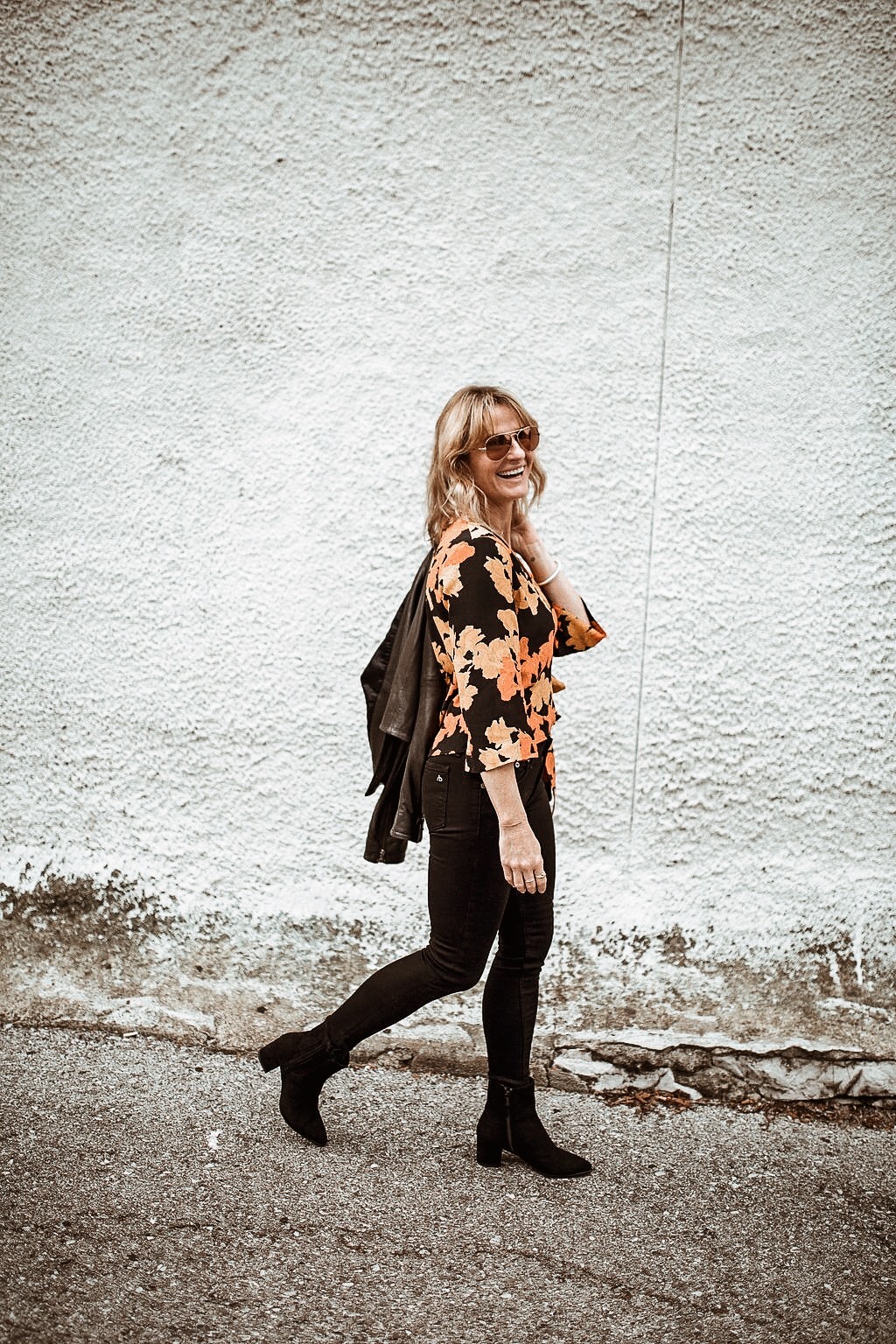 wrap top styled with black jeans, leather coat and boots | oh darling blog