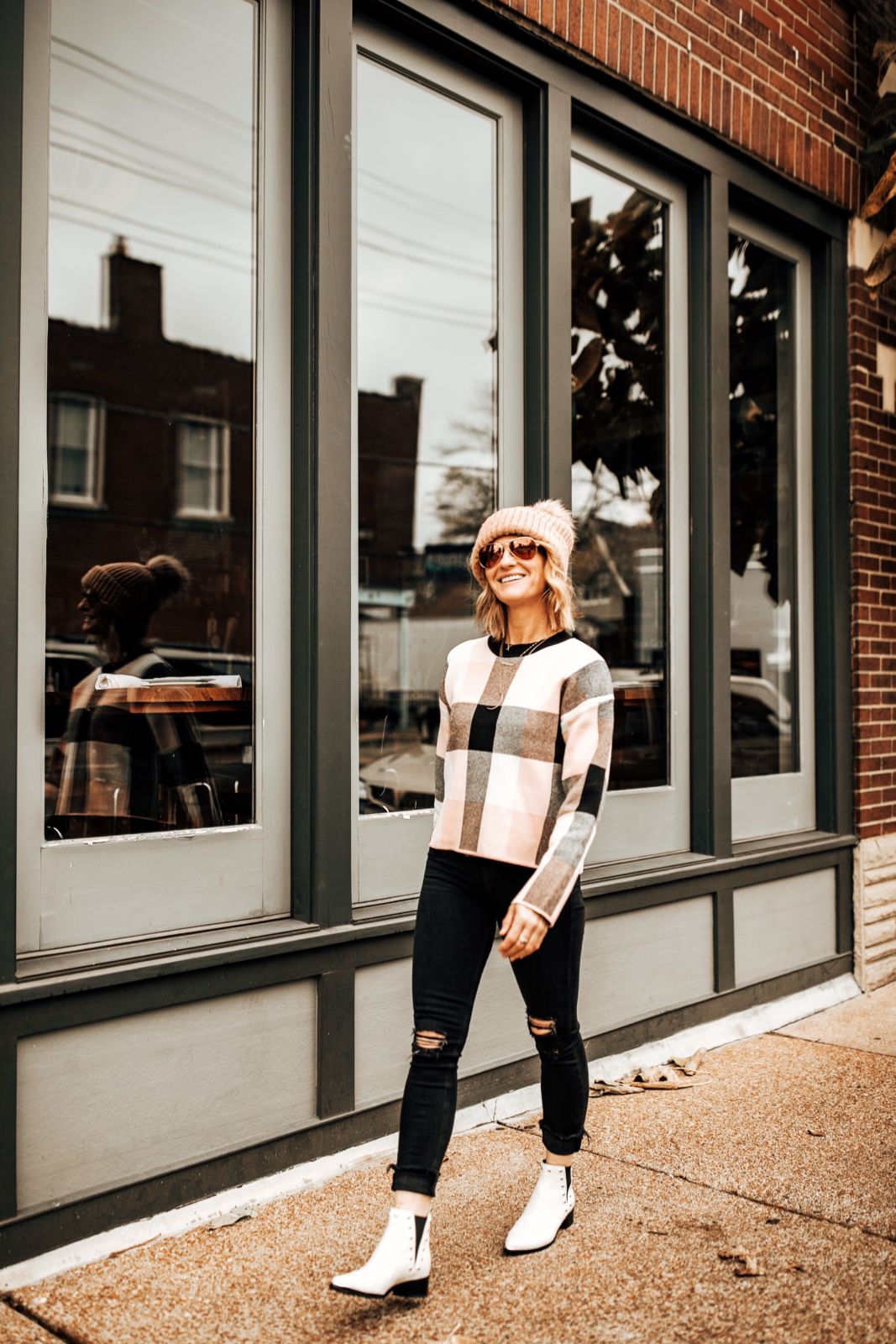 casual holiday outfit ideas | pink buffalo plaid | knitted beanie | white cowboy booties | black distressed jeans | oh darling blog