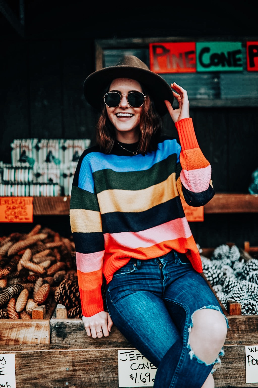 how to enjoy the holidays | knitted belle | kindred shops | st louis | winter style | rainbow stripe sweater | ripped jeans | winter style | winter style inspiration | oh darling blog