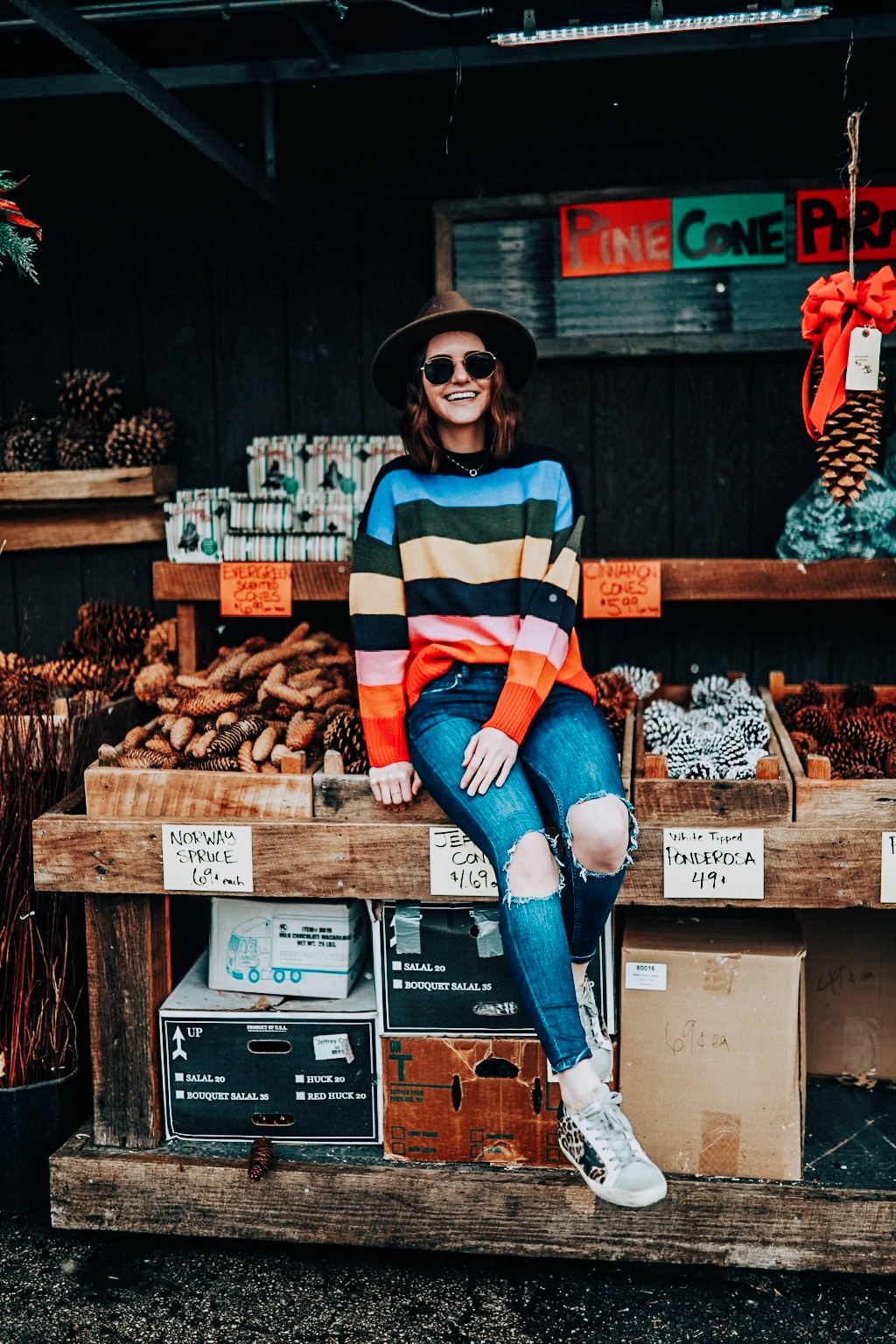 how to enjoy the holidays | knitted belle | kindred shops | striped sweater | golden goose sneakers | winter style | distressed denim | outfit inspiration | oh darling blog