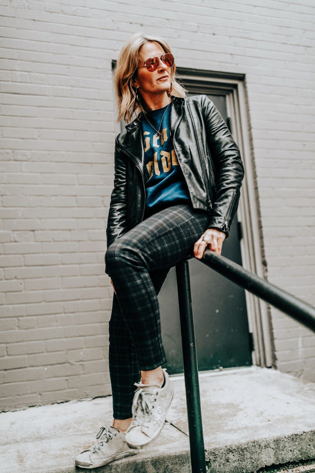how to style a graphic sweatshirt | golden goose sneakers \ leather jacket | plaid pants | winter style | oh darling blog