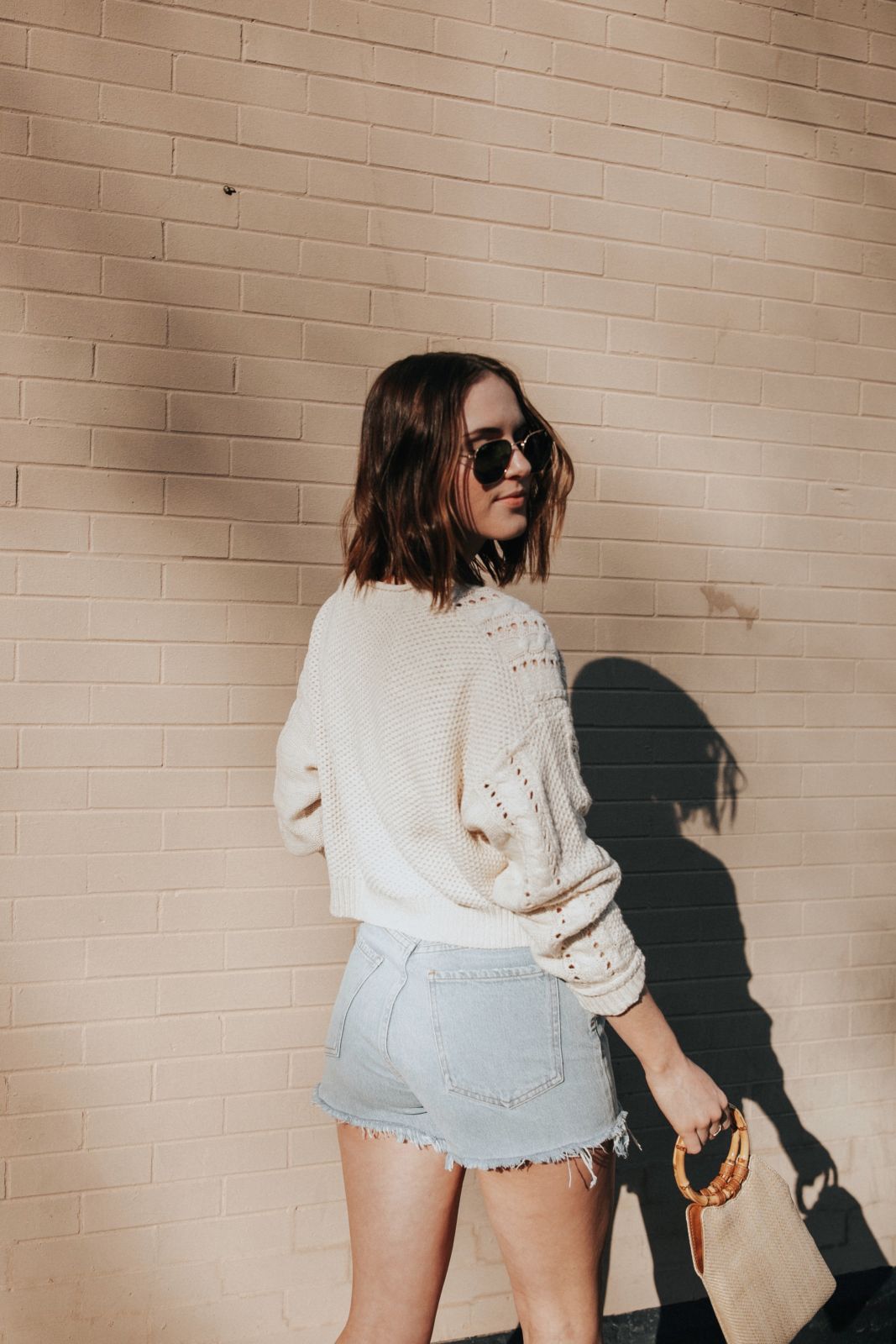 white sweater and shorts outfit